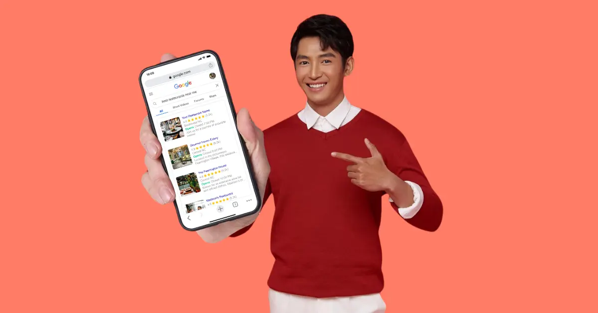 Man showing Google search results—local SEO for restaurants in action.